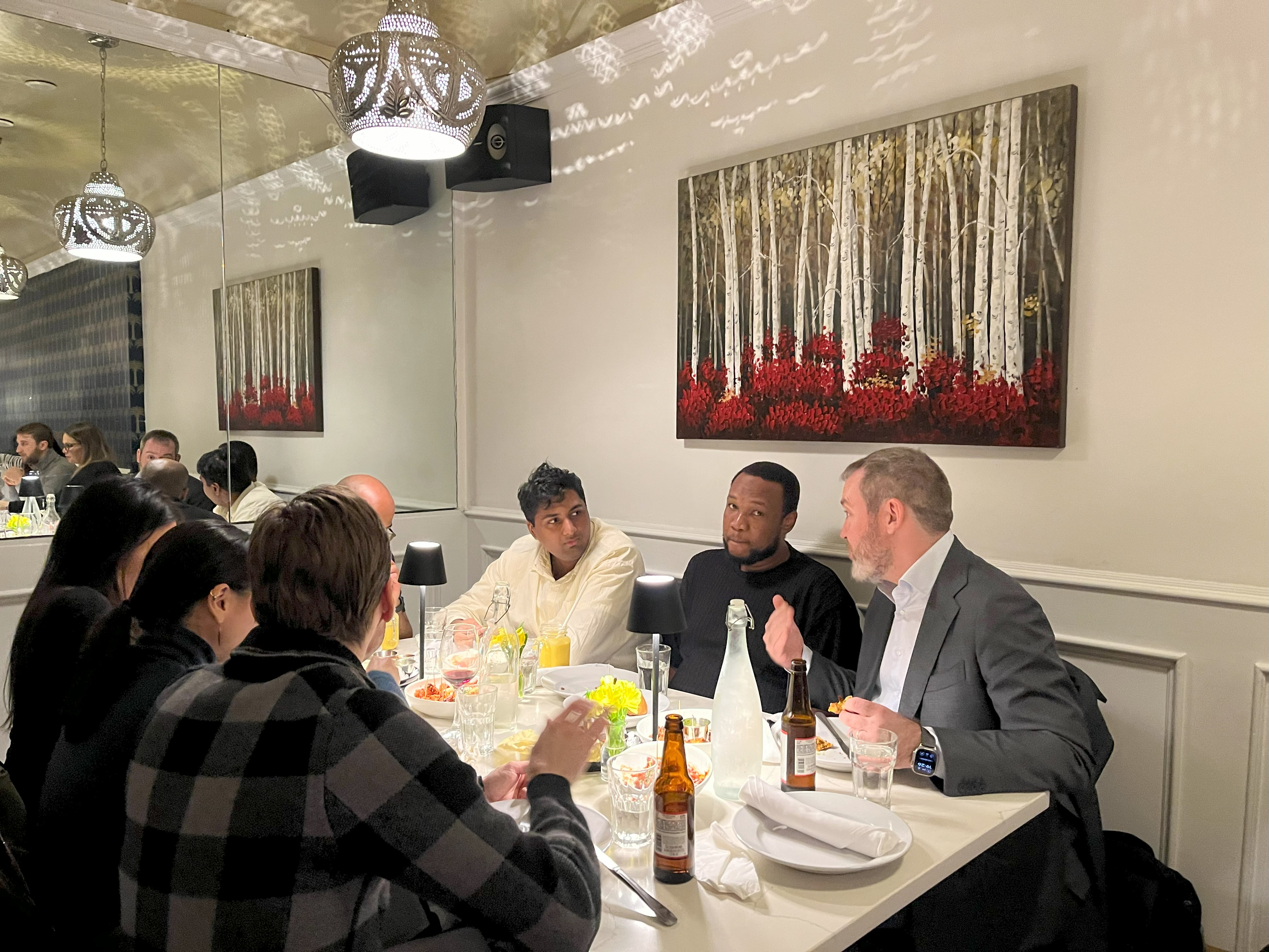 People enjoying beer and curry
