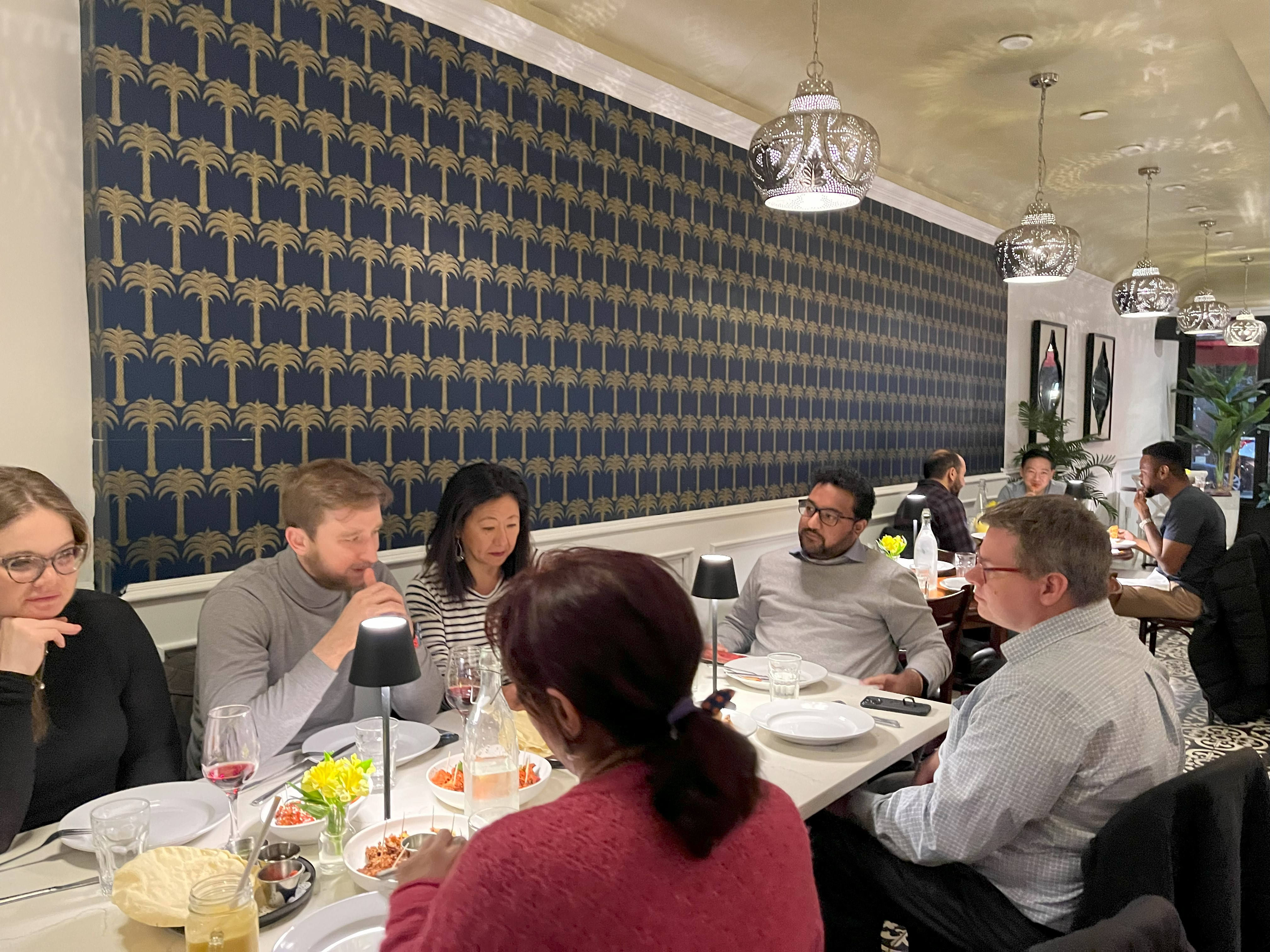 People enjoying beer and curry