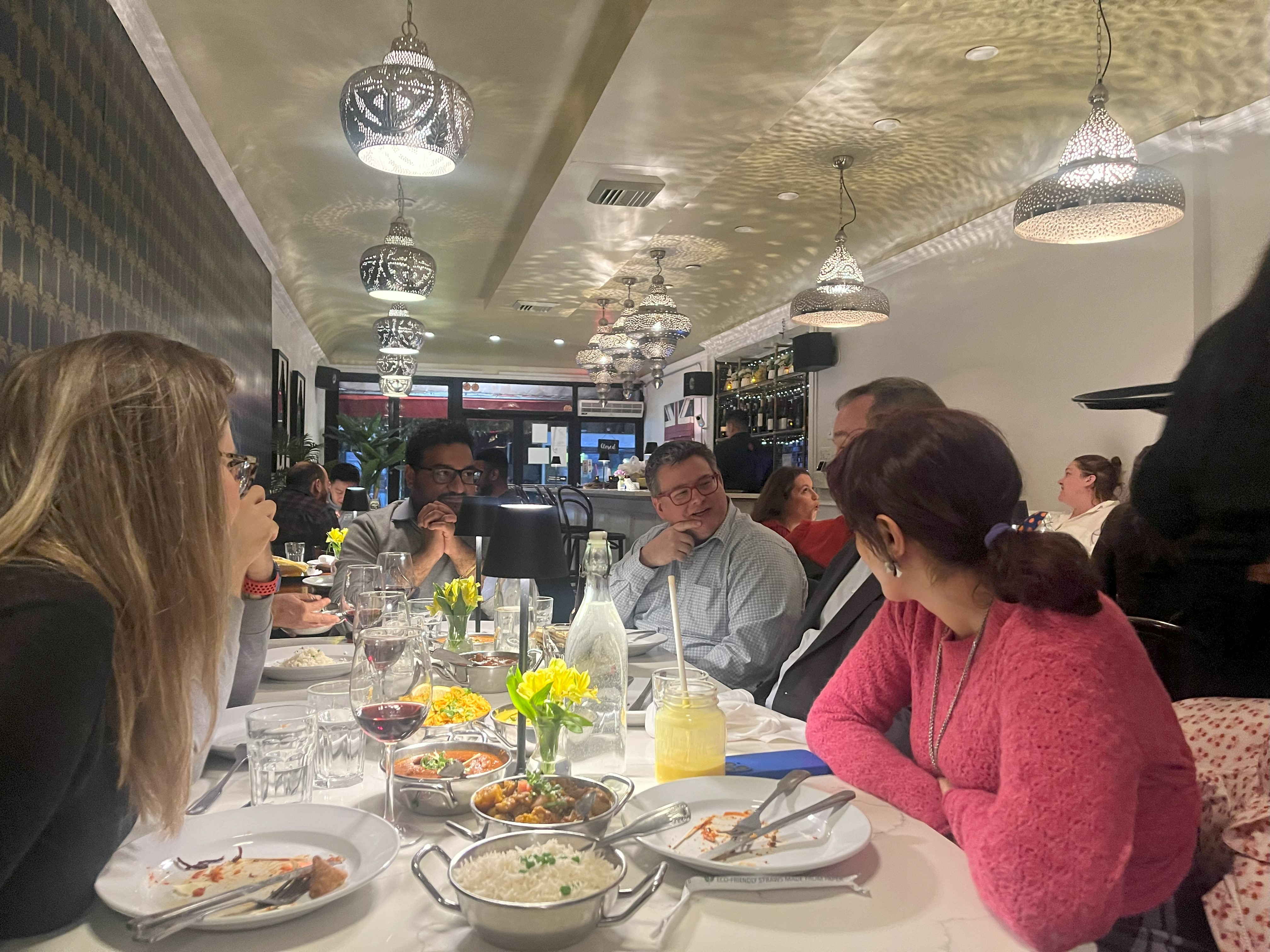 People enjoying beer and curry